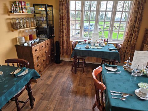 view of the dining room and view into garden
